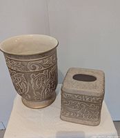 Wastebasket and tissue box cover showing design, color and condition