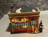 Front angled view showing ACE Hardware facade lit