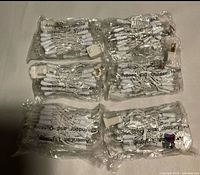 Six sealed American Lighting LED mini light sets in clear bags