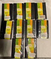 Ten sealed Baran business card holder books front view