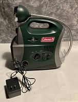 Left side view of Coleman King Cobra lantern showing controls and included AC adapter