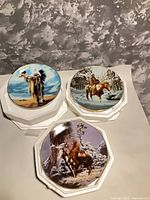 All three Hamilton Collection plates on display