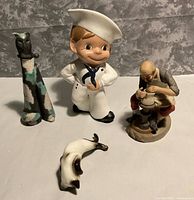 Group shot of all four resin figurines