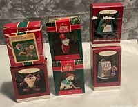 Front view of six boxed Hallmark ornaments