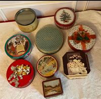 Group shot of all nine tins arranged on surface