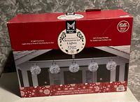 Front of Member's Mark LED Ornament Lights box showing product details and image of five illuminated ornaments