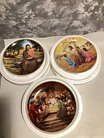 Three ARTAFFECTS religious plates stacked showing front artwork and gold rim