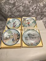 All four boxed plates showing scenic designs