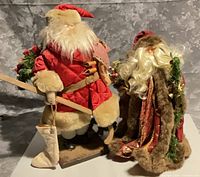 Front and side view of both Santa figurines