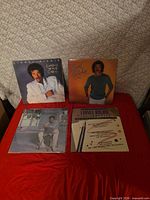 Four Lionel Richie album covers displayed together