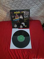 Front cover and vinyl record on sleeve