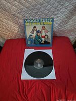 Front album cover and vinyl record on sleeve