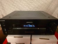 Front view of Sony STR-DB930 receiver showing power on display