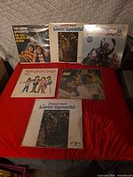 All six album fronts laid out