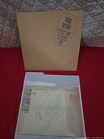 Front of gatefold sleeve with title and separate unopened insert packet