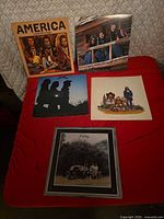 All five America LP records displayed