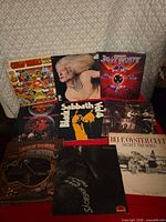 All nine record albums laid out showing front covers