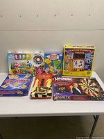 All six boxed games displayed on table