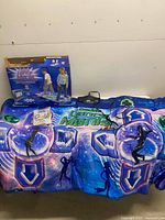 Dance mat laid out with box, manual and cable visible