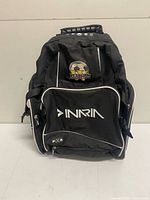 Front view of black Inaria PX-S backpack with Wesburn Football Club logo