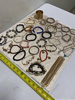 Overhead view of entire assortment laid on cloth with ruler for scale