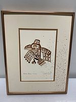 Frontal view of framed Bill Reid print showing design, matting and frame