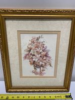 Full view of framed print with ruler for scale