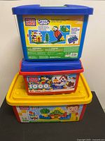 Stacked view of three Mega Bloks tubs