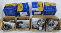 Eight Weiser boxed deadbolt locksets with contents displayed