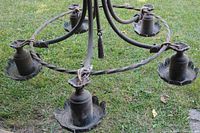 Full view of chandelier showing five sockets, circular ring and central stem