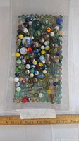 Top view of full bin showing quantity and variety of marbles