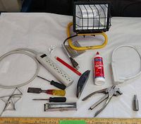 All items overview with flood light, extension cords, hand tools and accessories