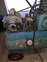 Left side showing motor, tank, wheel, pressure gauge, Webster decal