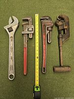 Overall lot: four tools next to measuring tape