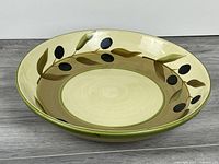 Top view of ceramic bowl showing olive branch design