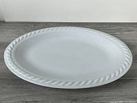 Top view of white oval platter showing rope rim