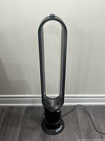 Full view of Dyson bladeless tower fan standing on floor