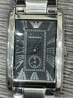 Front close-up of watch face showing dial, logo, sub-dial and case condition