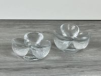 Two clear textured glass tulip candle holders front view
