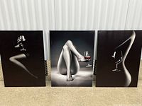 Front view of all three canvas prints standing side-by-side