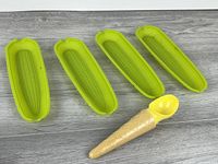 overview of four green corn trays and ice cream scoop