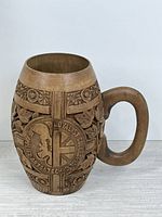 Full view of mug showing crest side and handle