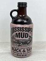 Front view showing Mississippi Mud label, handle and bottle shape