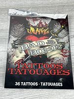 Front of sealed Bad to the Bone temporary tattoo pack