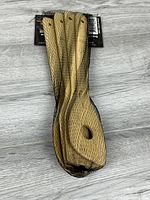 Packaged set of four wooden utensils in mesh sleeve with header card