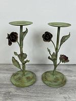Front view of both metal rose candle holders