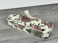 Covered dish closed showing floral pattern and handle