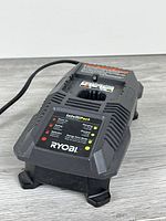 Top angled view showing overall charger body, cord, LED panel