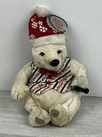 Front view of Coca-Cola polar bear plush showing overall appearance and accessories