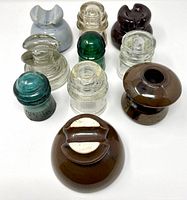 Group view of nine insulators showing assorted colors and shapes